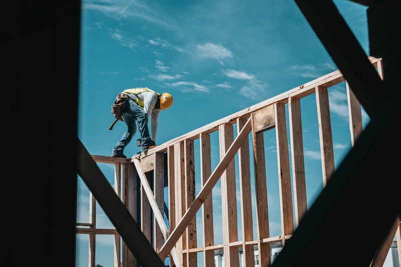 Carpenter framing the second floor of a new house